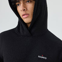 Person wearing a black hoodie with Suunto logo on a light gray background